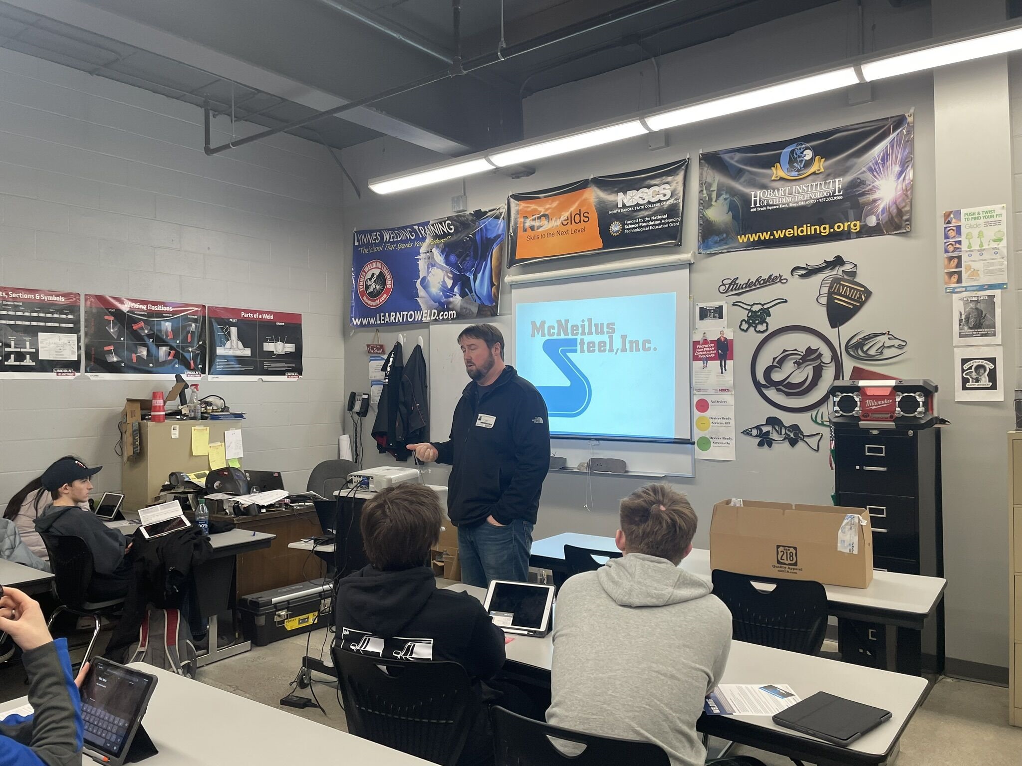 West Fargo McNeilus Steel McNeilus Steel employee speaking to a classroom of students at West Fargo High School